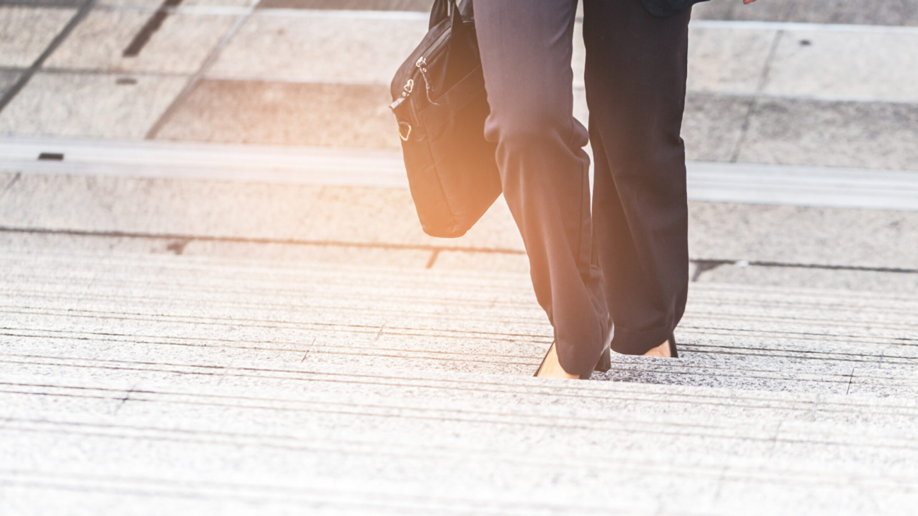 Business women the stairs in a rush hour to work.