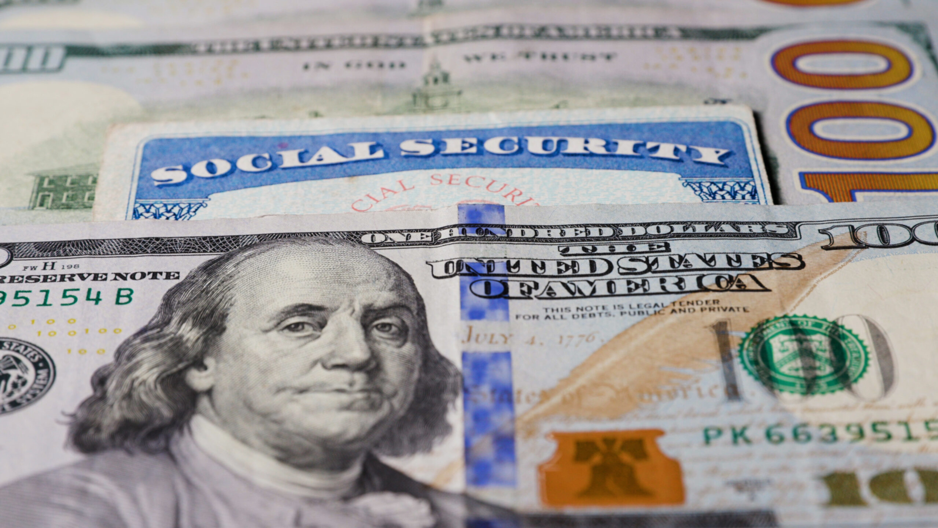 Photo of social security card with one hundred dollar bills. High quality photo