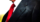 a black business suit jacket with white shirt and red tie, man n