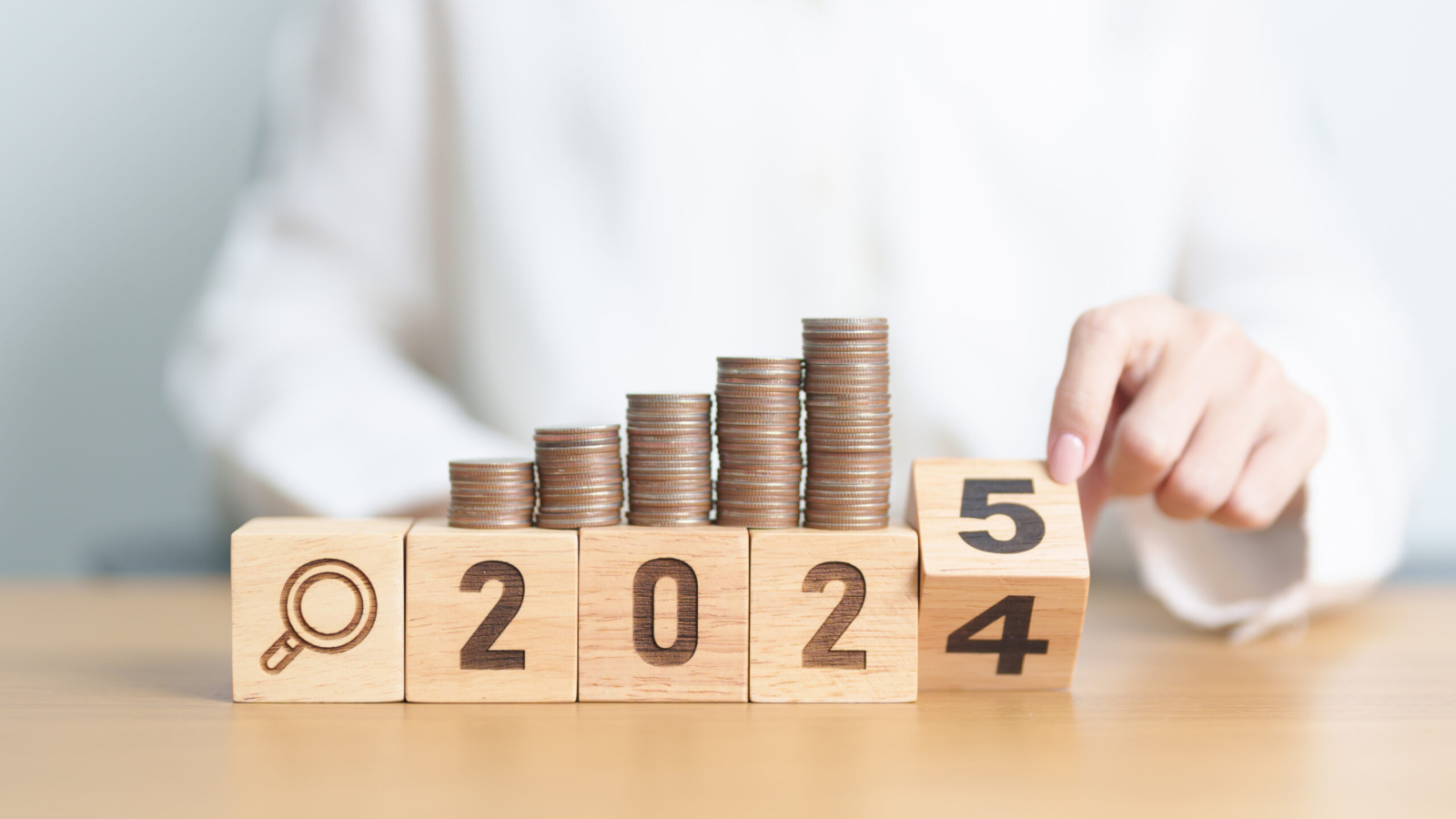 2024 end year to Happy New Year 2025 with  coins money stack growing with magnifier glass. Money saving, Inflation, tax, cash flow, Job search, hiring and research development concepts