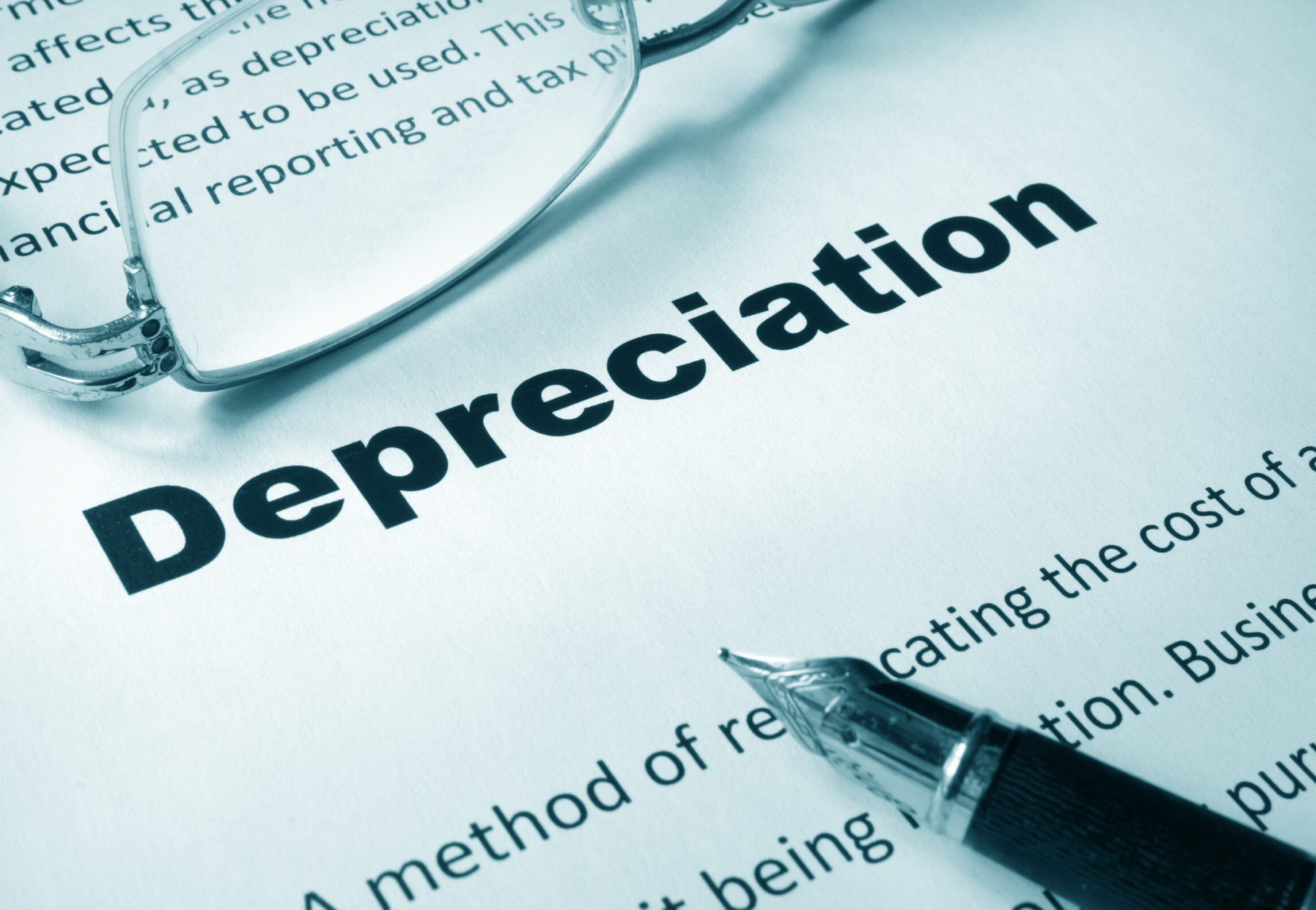 Paper with sign Depreciation and a pen. Business concept.