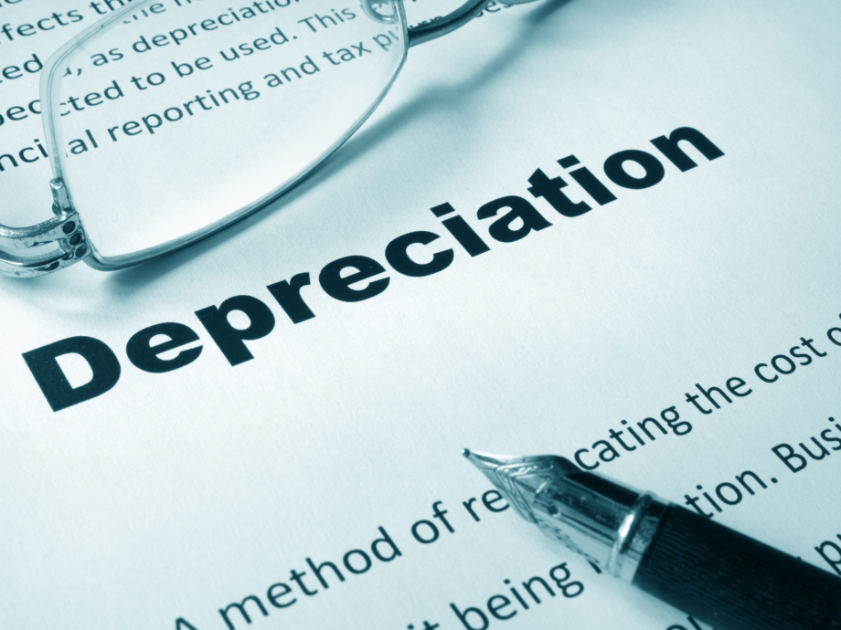 Paper with sign Depreciation and a pen. Business concept.