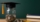 Student success scholarships aimed at alleviating education costs. A glass jar full of coins and a graduation cap symbolize both investment in education and saving for college.
